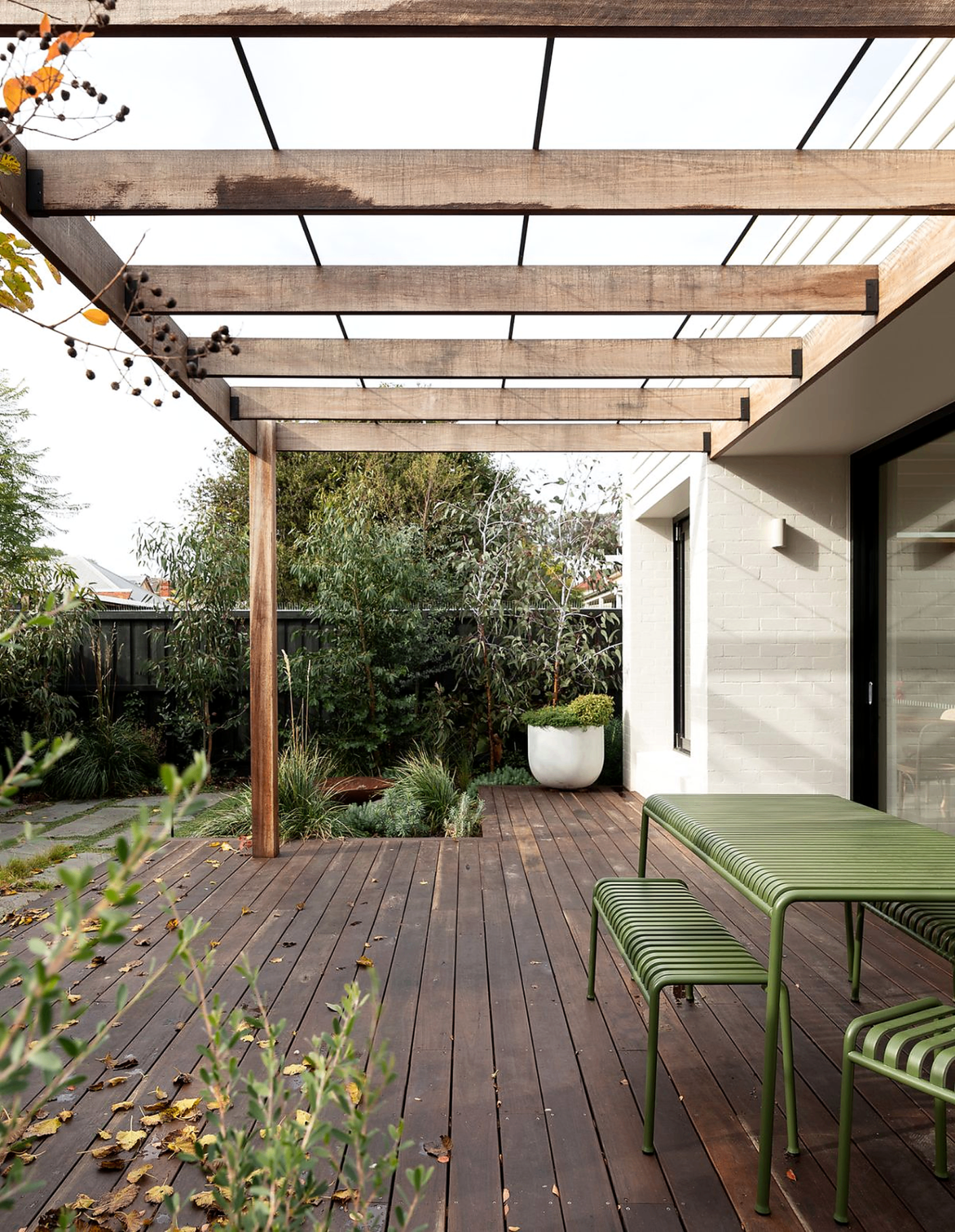 Timber pergola over a hardwood deck with outdoor dining